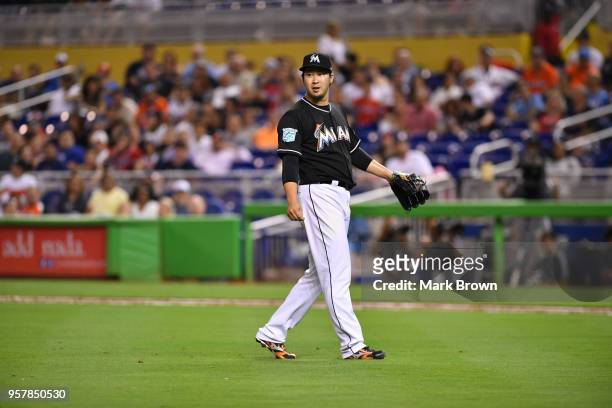 Junichi Tazawa of the Miami Marlins pitches in the eighth inning against the Atlanta Braves at Marlins Park on May 12, 2018 in Miami, Florida.