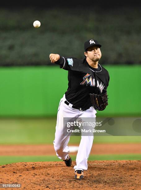 Junichi Tazawa of the Miami Marlins warms up in the eighth inning against the Atlanta Braves at Marlins Park on May 12, 2018 in Miami, Florida.