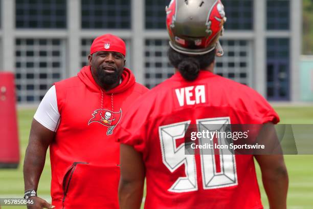 Defensive line coach Brentson Buckner instructs 2018 first round pick Vita Vea during the Tampa Bay Buccaneers Rookie Minicamp on May 12, 2018 at One...