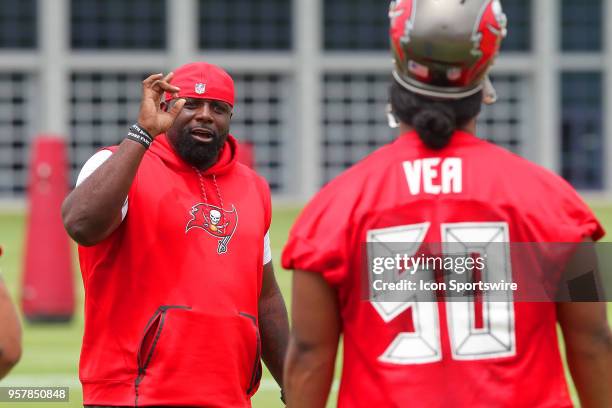 Defensive line coach Brentson Buckner instructs 2018 first round pick Vita Vea during the Tampa Bay Buccaneers Rookie Minicamp on May 12, 2018 at One...