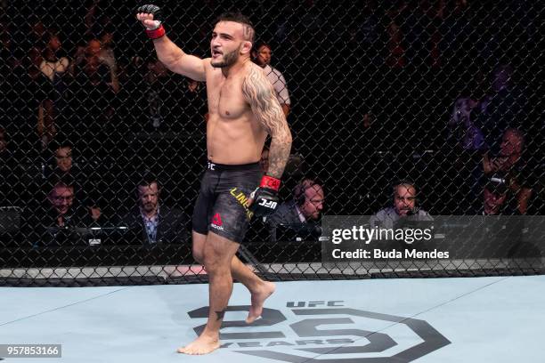 John Lineker of the Brazil celebrates victory over Brian Kelleher of the United States in their bantamweight bout during the UFC 224 event at...