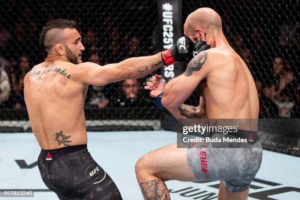 John Lineker of the Brazil punches Brian Kelleher of the United States in their bantamweight bout during the UFC 224 event at Jeunesse Arena on May...