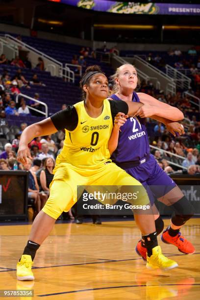 Khaalia Hillsman of the Seattle Storm plays defense against Marie Gulich of the Phoenix Mercury during a pre-season game on May 12, 2018 at Talking...