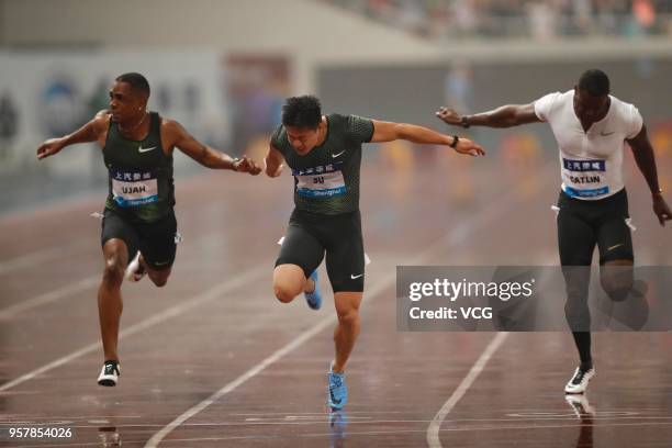 Su Bingtian of China and Justin Gatlin of the U.S. Compete during the men's 100m of IAAF Diamond League Shanghai competition at Shanghai Stadium on...