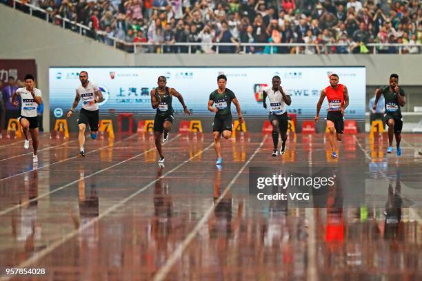 Su Bingtian of China and Justin Gatlin of the U.S. Compete during the men's 100m of IAAF Diamond League Shanghai competition at Shanghai Stadium on...