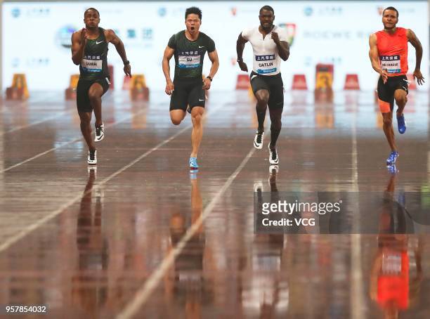 Su Bingtian of China and Justin Gatlin of the U.S. Compete during the men's 100m of IAAF Diamond League Shanghai competition at Shanghai Stadium on...