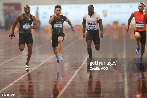 Su Bingtian of China and Justin Gatlin of the U.S. Compete during the men's 100m of IAAF Diamond League Shanghai competition at Shanghai Stadium on...