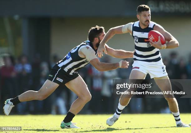 Aaron Black of Geelong Cats is tackled during the round six VFL match between the Collingwood Magpies and the Geelong Cats at Olympic Park on May 13,...