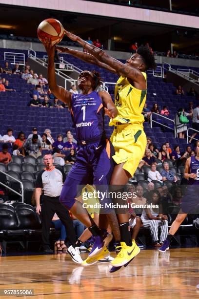 Imani Wright of the Phoenix Mercury goes to the basket against Natasha Howard of the Seattle Storm during a pre-season game on May 12, 2018 at...