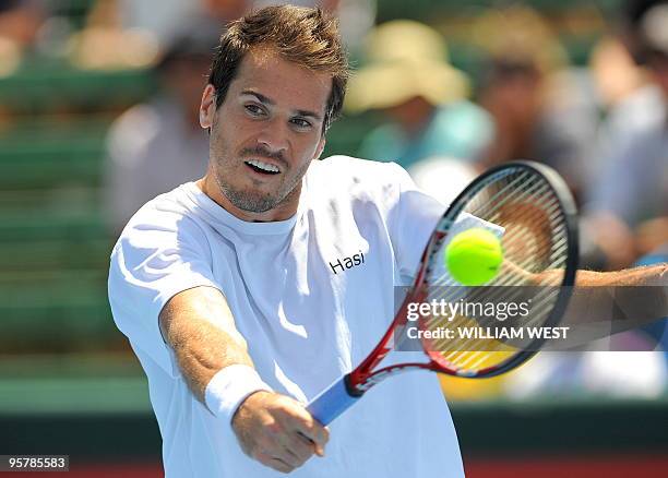 Tommy Haas of Germany hits a backhand return during his loss to Jo-Wilfried Tsonga of France at the Kooyong Classic tennis tournament, in Melbourne...