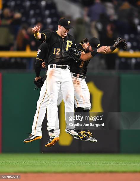 Corey Dickerson celebrates with Starling Marte and Sean Rodriguez of the Pittsburgh Pirates after a 6-5 win over the San Francisco Giants at PNC Park...
