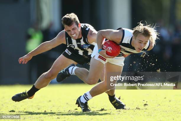 Jackson Mclachlan of Geelong Cats is tackled during the round six VFL match between the Collingwood Magpies and the Geelong Cats at Olympic Park on...
