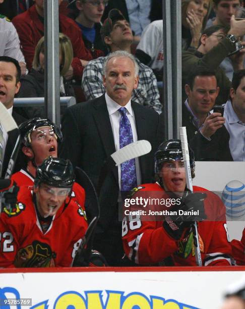 Head coach Joel Quenneville of the Chicago Blackhawks watches from bench along with Kris Versteeg, Jonathan Toews and Patrick Kane as the Blackhawks...