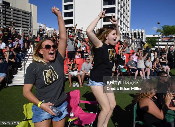 Jennifer Heck and her daughter Mady Heck, both of Nevada, celebrate at a Vegas Golden Knights road game watch party at the Downtown Las Vegas Events...