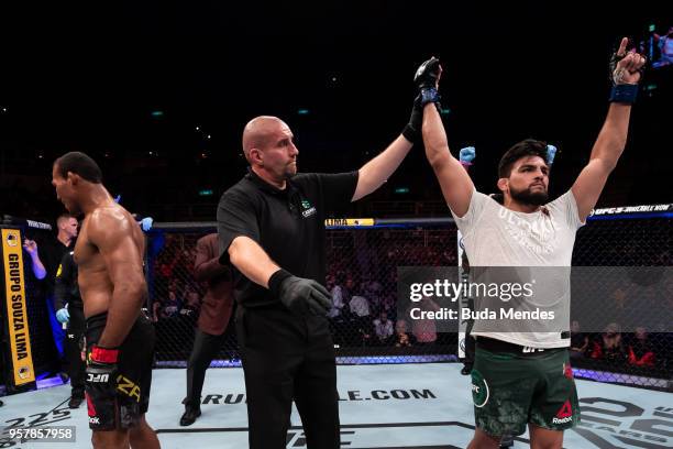 Kelvin Gastelum of the United States celebrates victory over Ronaldo Souza of Brazil in their middleweight bout during the UFC 224 event at Jeunesse...