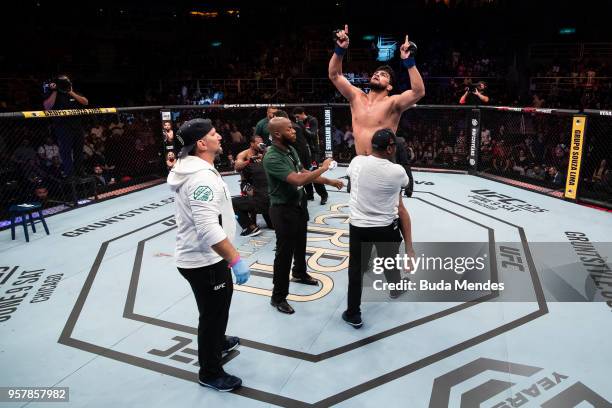 Kelvin Gastelum of the United States celebrates victory over Ronaldo Souza of Brazil in their middleweight bout during the UFC 224 event at Jeunesse...