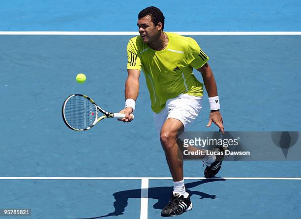 Jo-Wilfried Tsonga of France plays a forehand in his third round match against Tommy Haas of Germany during day three of the 2010 Kooyong Classic at...