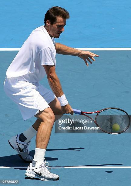 Tommy Haas of Germany plays a backhand in his third round match against Jo-Wilfried Tsonga of France during day three of the 2010 Kooyong Classic at...