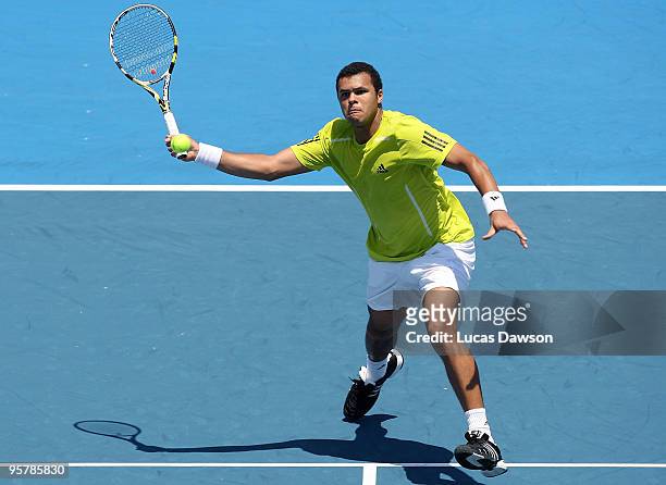 Jo-Wilfried Tsonga of France plays a forehand in his third round match against Tommy Haas of Germany during day three of the 2010 Kooyong Classic at...
