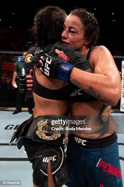 Amanda Nunes of Brazil celebrates victory over Raquel Pennington of the United States in their women's bantamweight bout during the UFC 224 event at...