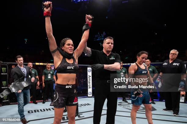 Amanda Nunes of Brazil celebrates victory over Raquel Pennington of the United States in their women's bantamweight bout during the UFC 224 event at...