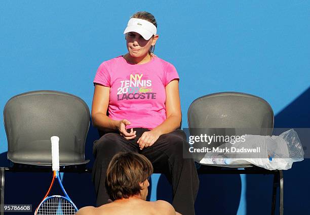 Jelena Dokic of Australia speaks with her coach Borna Bikic during a practice session ahead of the 2010 Australian Open at Melbourne Park on January...