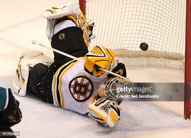 Tim Thomas of the Boston Bruins makes a save against the San Jose Sharks during an NHL game at the HP Pavilion on January 14, 2010 in San Jose,...