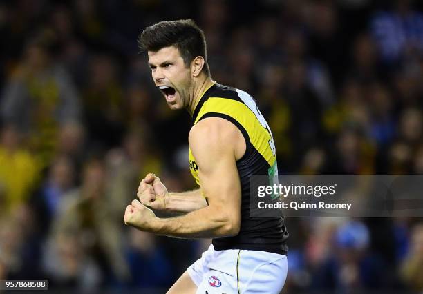 Trent Cotchin of the Tigers celebrates kicking a goal during the round eight AFL match between the North Melbourne Kangaroos and the Richmond Tigers...