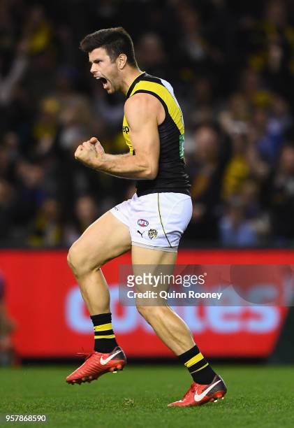Trent Cotchin of the Tigers celebrates kicking a goal during the round eight AFL match between the North Melbourne Kangaroos and the Richmond Tigers...