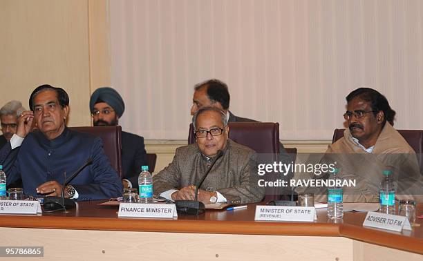 Indian Finance Minister Pranab Mukherjee and his Deputy Ministers of State S S Palanimanickam and Namo Narain Meena attend a pre-budget meeting with...