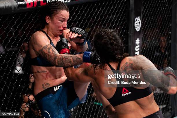 Amanda Nunes of Brazil punches Raquel Pennington of the United States in their women's bantamweight bout during the UFC 224 event at Jeunesse Arena...