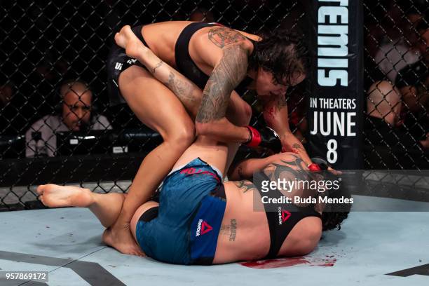 Amanda Nunes of Brazil submit Raquel Pennington of the United States in their women's bantamweight bout during the UFC 224 event at Jeunesse Arena on...