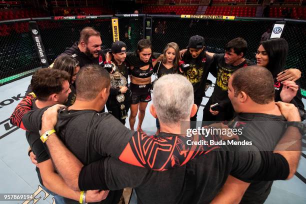 Amanda Nunes of Brazil celebrates victory over Raquel Pennington of the United States in their women's bantamweight bout during the UFC 224 event at...