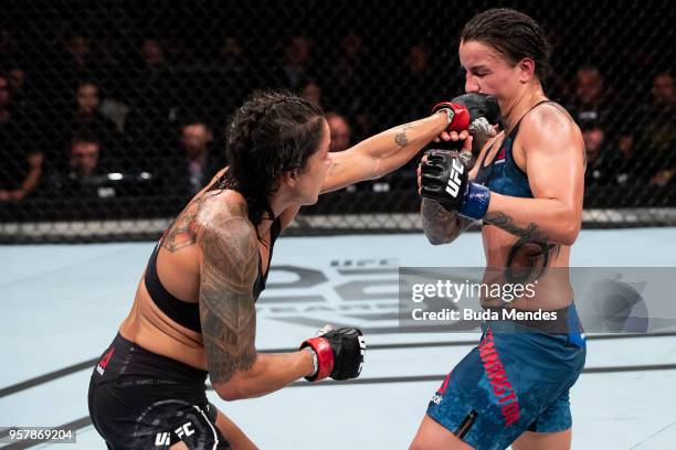 Amanda Nunes of Brazil punches Raquel Pennington of the United States in their women's bantamweight bout during the UFC 224 event at Jeunesse Arena...