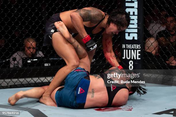 Amanda Nunes of Brazil submit Raquel Pennington of the United States in their women's bantamweight bout during the UFC 224 event at Jeunesse Arena on...