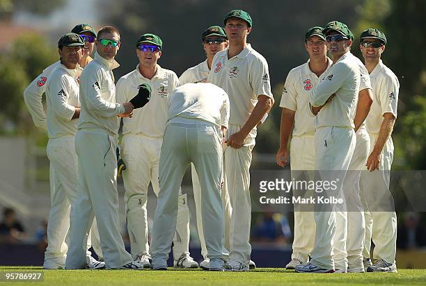 The Australian team watch the replay of a dismissal on the big screen during day two of the Third Test match between Australia and Pakistan at...