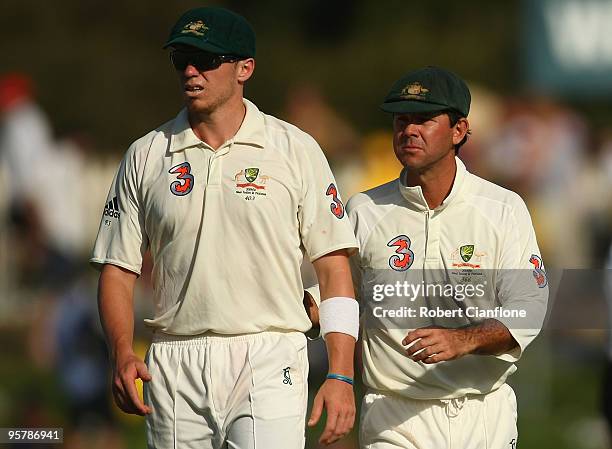 Peter Siddle and Rocky Ponting of Australia walk fom the ground after play on day two of the Third Test match between Australia and Pakistan at...