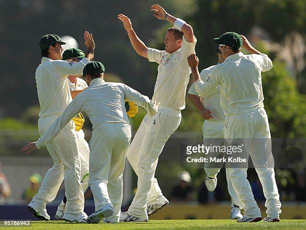 Peter Siddle of Australia celebrates taking the wicket of Imran Farhat of Pakistan with his team mates during day two of the Third Test match between...