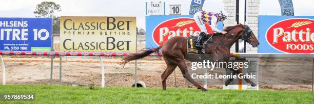 Smooth Hustler ridden by Georgina Cartwright wins the Frais Farms C,G&E BM58 Handicap at Bairnsdale Racecourse on May 13, 2018 in Bairnsdale,...