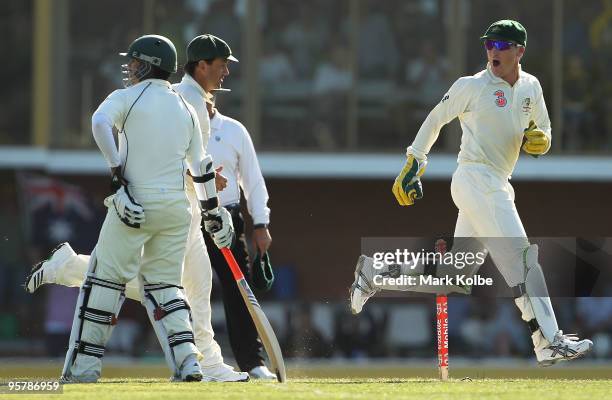 Brad Haddin of Australia celebrates as he passes Salman Butt of Pakistan after running out Mohammad Yousuf of Pakistan during day two of the Third...