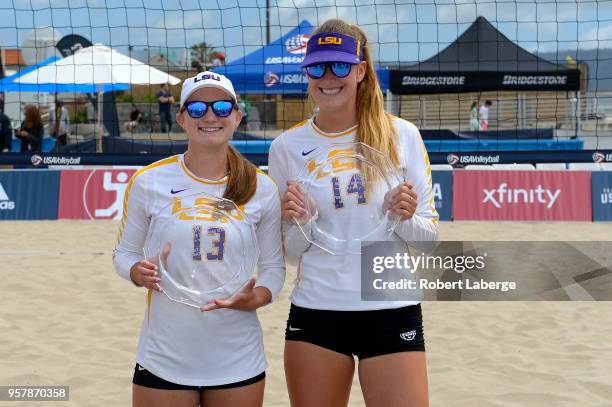 Kristen Nuss and Claire Coppola pose with the winner's trophies after winning the women's final during the Bridgestone USA Volleyball Collegiate...