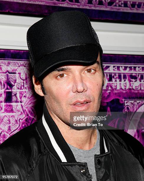 Photographer David LaChapelle poses in front of his art photography at the 19th Annual International Los Angeles Photographic Art Exposition Opening...