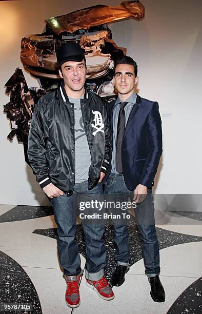 Photographer David LaChapelle and boyfriend Drew Kuhse pose in front of LaChapelle's art photography at the 19th Annual International Los Angeles...