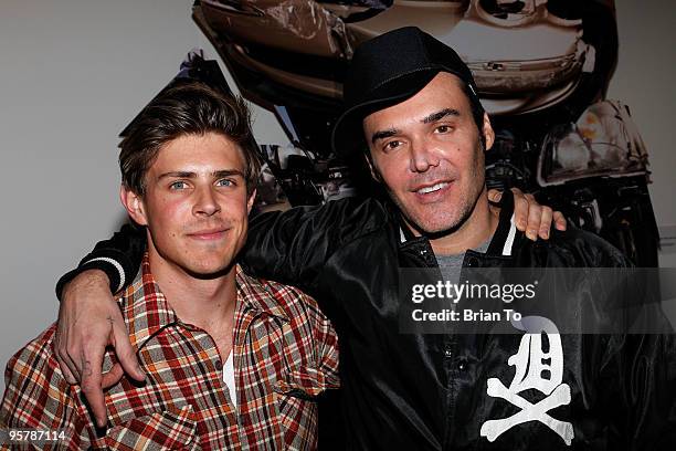 Actor Chris Lowell and photographer David LaChapelle pose at the 19th Annual International Los Angeles Photographic Art Exposition Opening at Santa...