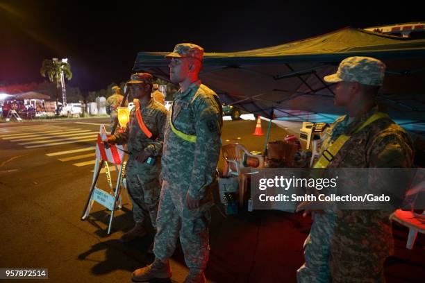 Hawaii National Guard Soldiers helping local Police Department at a traffic control point during a volcanic outbreak, Pahoa Hawaii, May 6, 2018....