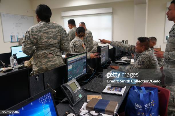 Members of the Hawaii National Guard's Task Force working at the office during a volcanic outbreak, Hilo Hawaii, May 6, 2018. Image courtesy Tech....