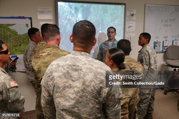 Hawaii National Guard Soldiers and Airmen briefing day activities during a volcanic outbreak, Hilo Hawaii, May 6, 2018. Image courtesy Tech. Sgt....