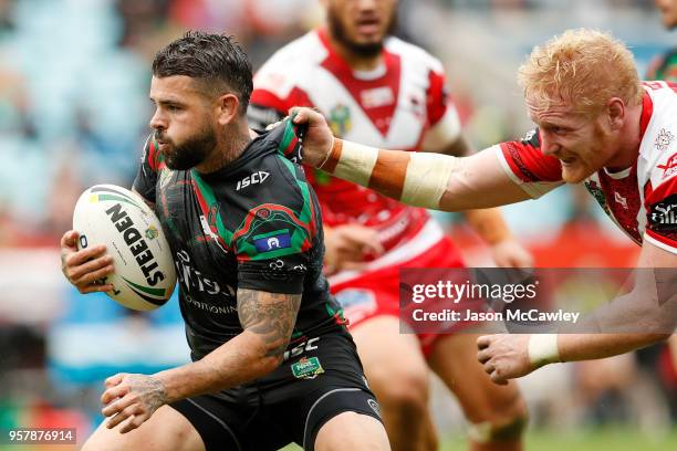 Adam Reynolds of the Rabbitohs is tackled by James Graham of the Dragons during the round 10 NRL match between the South Sydney Rabbitohs and the St...