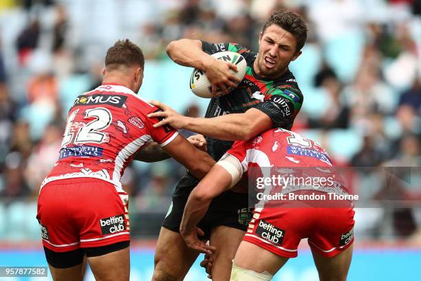Samuel Burgess of the Rabbitohs is tackled by the Dragons defence during the round 10 NRL match between the South Sydney Rabbitohs and the St George...
