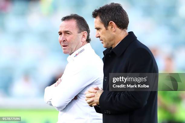 Raiders coach Ricky Stuart speaks to channel nine commentator and NSW Blues coach Brad Fittler before the start of the round 10 NRL match between the...